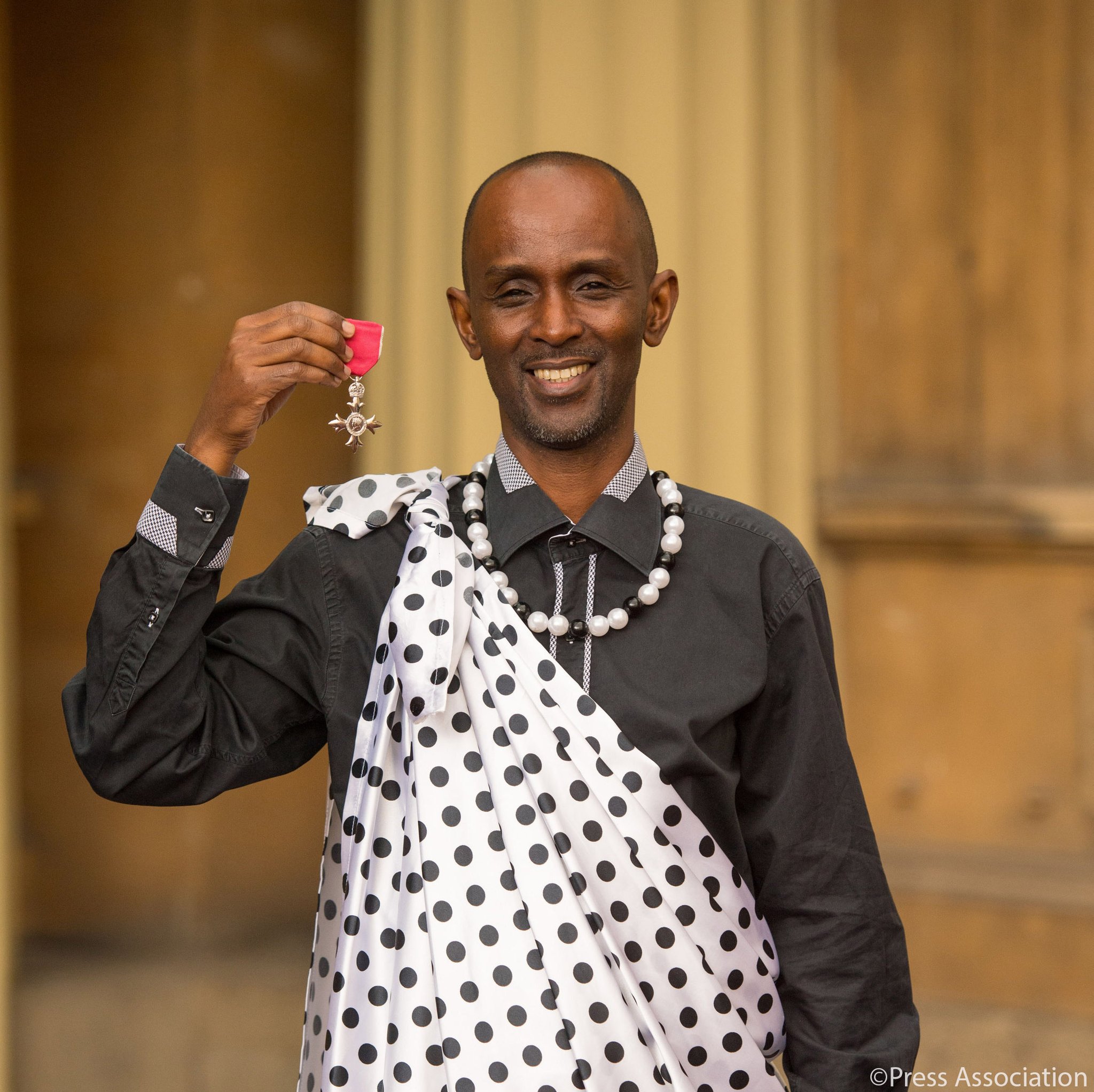 Eric Murangwa MBE Award at Buckingham Palace